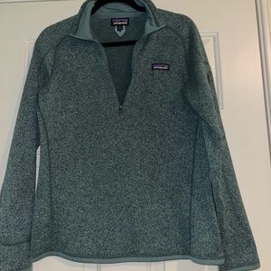 Green Patagonia crew neck sweater with a zipper